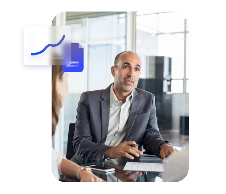 Businessman discussing documents with overlay icons for business analytics and documentation.