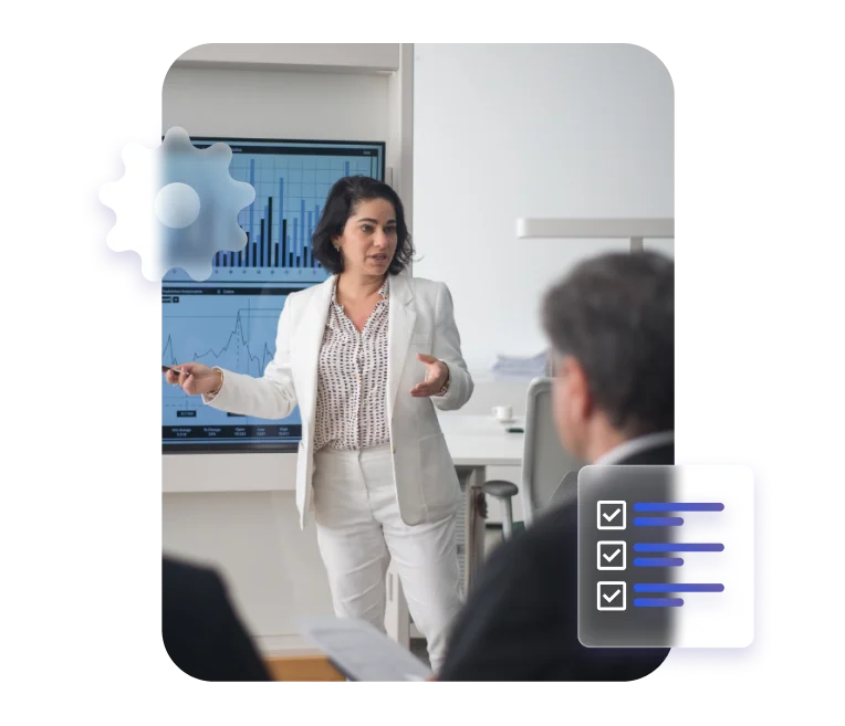 Businesswoman presenting data on a screen, symbolizing analytics and task management.